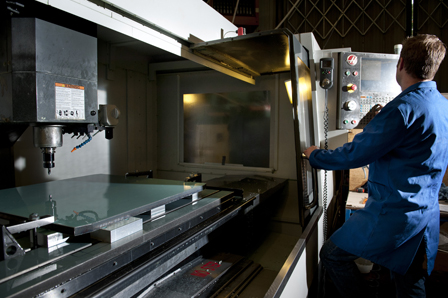 Thompson using a CNC scanner Thompson Precision team member with CNC Scanner