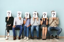 people standing up people with question marks
